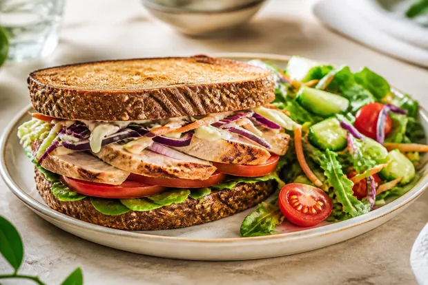 Chicken sandwich with a side salad